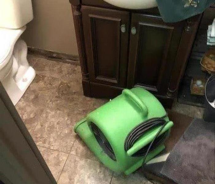Air dryer on a bathroom floor.