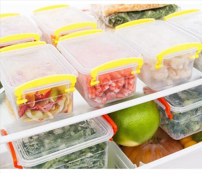 Food in containers inside a refrigerator